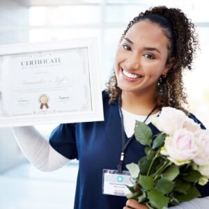 Certificate, rose and portrait with a black woman graduate in the hospital, proud of her achievemen